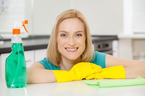 Technician wearing PPE during a carpet cleaning job in SW11
